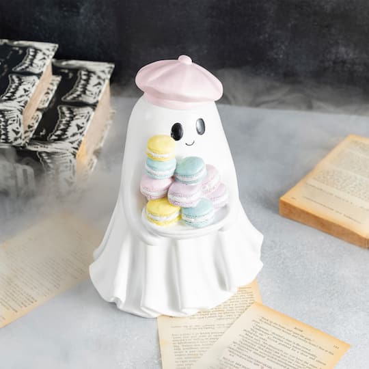 Glitzhome® 9.75" Halloween Polyresin Ghost with Macarons Table Decor